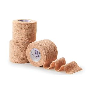 Three beige self-adhesive medical bandage rolls for wound care and support