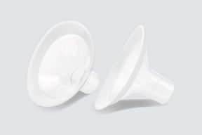 Pair of clear PersonalFit Flex breast pump shields on a light background