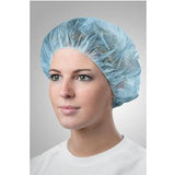 Woman wearing blue disposable medical bouffant cap, ideal for hygiene and hospital use