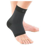 black ankle compression sleeve on bare foot, breathable medical support garment