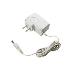 White medical device power adapter with attached cord and plug, isolated on white background