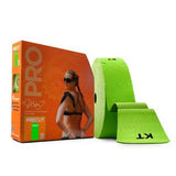 Green kinesiology tape roll with packaging showing athletic woman, physical therapy supply