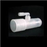 Transparent medical adapter valve for respiratory equipment on black background