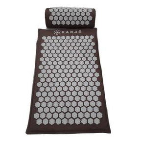 Brown acupressure mat and pillow set with white hexagonal spikes for pain relief