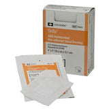 Antimicrobial non-adherent island dressing box with individual wound dressings visible