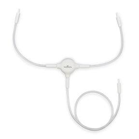 Breast pump tubing replacement kit with clear connectors and white tubing on white background.