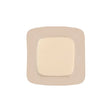 Sterile square medical adhesive wound dressing with beige border on white background