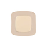 Sterile square medical adhesive wound dressing with beige border on white background
