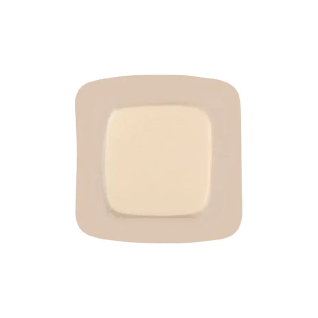 Sterile square medical adhesive wound dressing with beige border on white background