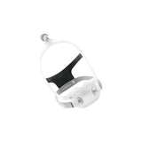 CPAP nasal mask with headgear for sleep apnea therapy on white background