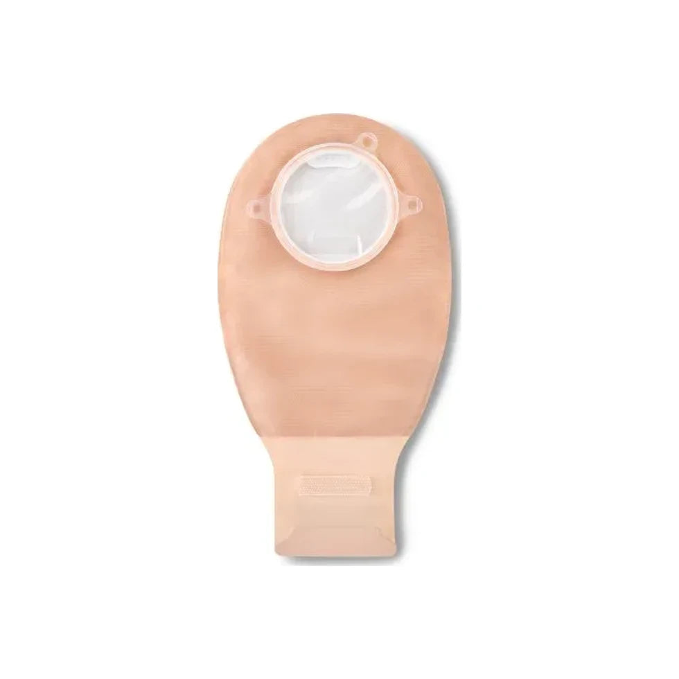 Beige ostomy pouch with circular adhesive barrier, drainable medical supply on white background.
