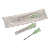 Sterile hypodermic needles with green hubs and protective caps, one in packaging