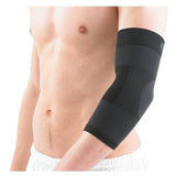Person wearing a black compression elbow sleeve for joint support and pain relief