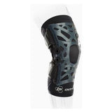 Lightweight medical knee brace with support hinges on a transparent mannequin leg