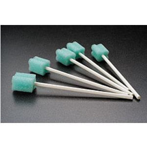 Green oral foam swabs with white handles for medical oral care on black background
