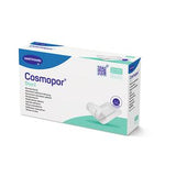 Cosmopor Steril wound dressing box with sterile adhesive bandages on white background
