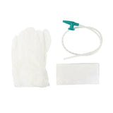 Medical supply set with disposable gloves, tube with green valve, and absorbent pad.