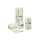 Assorted medical gauze rolls and bandage wraps on a white background