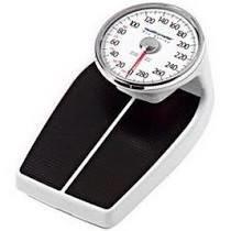Analog bathroom scale with black platform and large dial for weight measurement