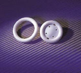 White medical silicone rings on purple textured background, incontinence device supplies