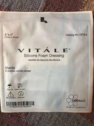 Vitale silicone foam dressing sterile medical bandage in sealed packaging on textured surface