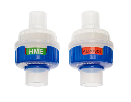 Two medical breathing filters labeled HME and AEROSOL for respiratory therapy use