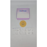 Ostomy barrier ring, adhesive patches, and Safe n Simple box on a white background