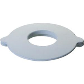 Round gray medical supply flange with central opening for ostomy or urostomy use