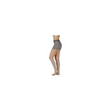 Person wearing beige medical compression thigh-high stocking on left leg