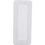 rectangular white adhesive medical bandage pad on plain background