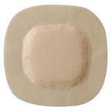 Hydrocapillary adhesive wound dressing with beige absorbent center and rounded edges