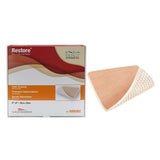 Adhesive hydrocolloid wound dressing with grid backing next to product box