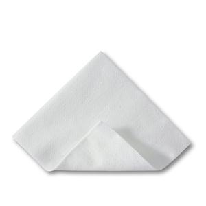 White disposable medical underpad folded on a plain background