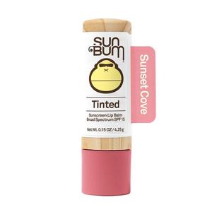 Tinted sunscreen lip balm stick labeled Sunset Cove, SPF 15, white and pink packaging