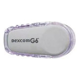 Dexcom G6 glucose sensor applicator for diabetes management, shown in close-up on white background