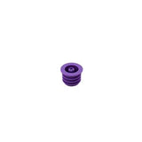 Purple medical vial stopper with grooved sides on white background