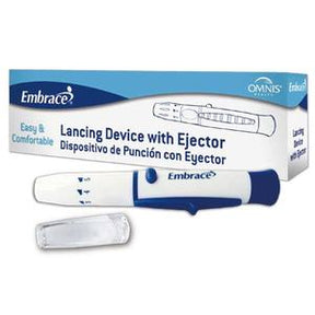 Lancing device with ejector and cap, shown in front of product packaging for blood testing.