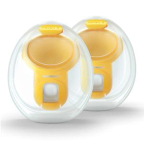 Two yellow and clear circular medical device applicators in plastic packaging on white background