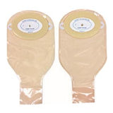 Two beige ostomy pouches with adhesive barriers for medical use, isolated on white background