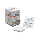 Sterile gauze pads and box, medical wound care supplies on white background
