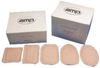 Assorted adhesive wound dressings in various shapes with boxes in background