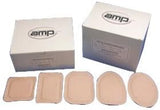 Assorted adhesive wound dressings in various shapes with boxes in background