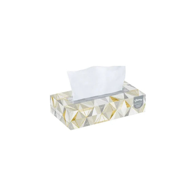 Rectangle tissue box with geometric gold and silver design, one tissue partially pulled out