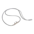 Clear nasal oxygen cannula tubing for respiratory therapy on white background