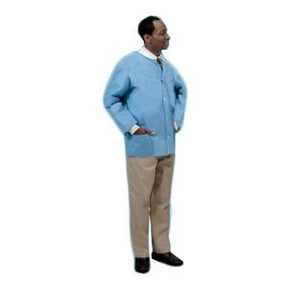 Man wearing a light blue medical lab coat and khaki pants, standing hands in pockets