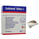 Cutimed Siltec L thin silicone foam dressing box and single absorbent medical dressing pad