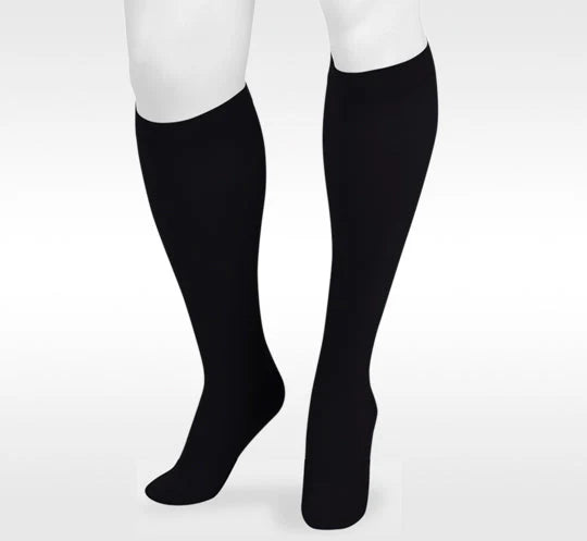 Black knee-high compression socks for medical and circulatory support