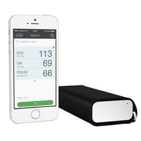 Mobile phone displaying blood pressure monitor app next to compact digital medical device