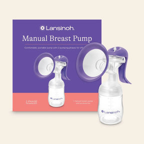 Lansinoh manual breast pump with purple and clear parts, box and product on cream background