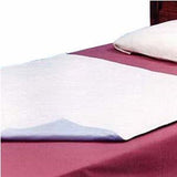 Disposable bed underpad on a maroon sheet, used for incontinence protection